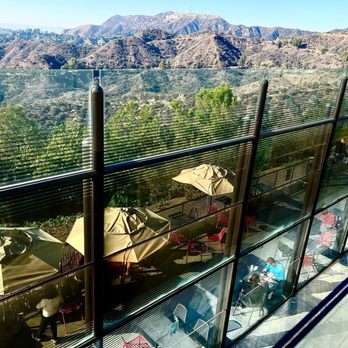 Griffith Observatory - Museum eatery called Cafe at the End of the Universe has nice views of the Hollywood sign (can see in the top middle area of the photo) - Observatories Near Me - Los Angeles, California Griffith Observatory - Museum eatery called Cafe at the End of the Universe has nice views of the Hollywood sign (can see in the top middle area of the photo) - Observatories Near Me - Los Angeles, California