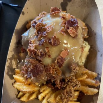 Funk 'n Waffles - Disco 'Stu - waffle fries, homemade chow ken tenders, mash potatoes, gravy, and bacon - New American Near Me - Syracuse, New York Funk 'n Waffles - Disco 'Stu - waffle fries, homemade chow ken tenders, mash potatoes, gravy, and bacon - New American Near Me - Syracuse, New York