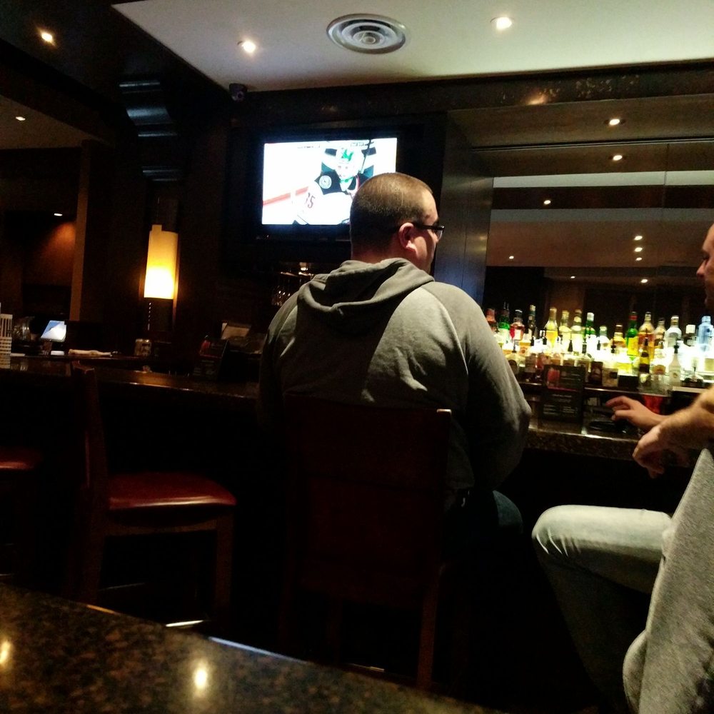 two men sitting at the bar two men sitting at the bar