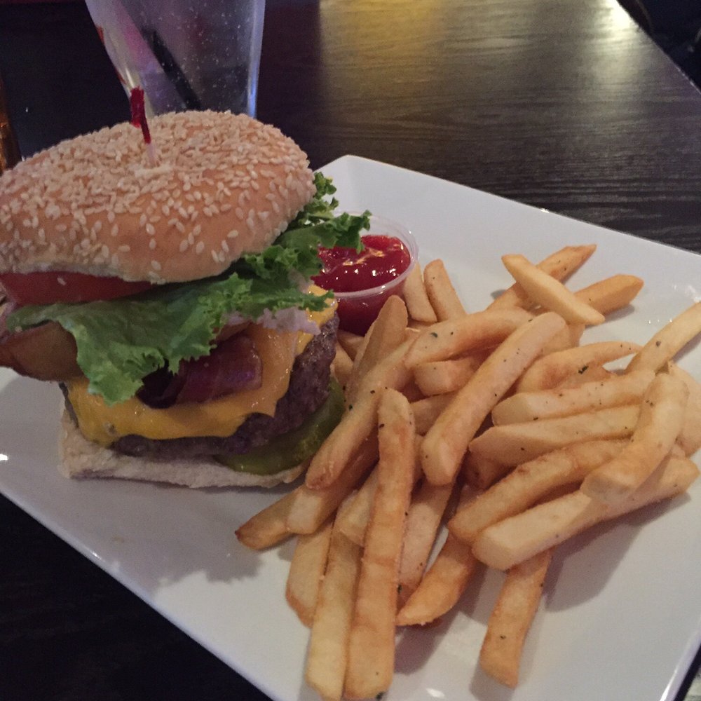 Rudi's - The Tony Oh No Romo burger and fries. Enough toppings to make your tastebuds dance. - Sports Bars Near Me - Patchogue, New York