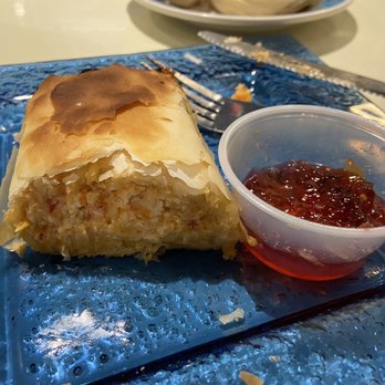 Athens Kouzzina - Baked Feta Puff - Greek Near Me - Lawrenceville, Georgia Athens Kouzzina - Baked Feta Puff - Greek Near Me - Lawrenceville, Georgia