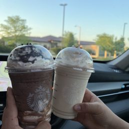 two cups of coffee in a car two cups of coffee in a car