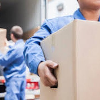 God's Moving Helpers - Team members unloading a customers items - Movers Near Me God's Moving Helpers - Team members unloading a customers items - Movers Near Me