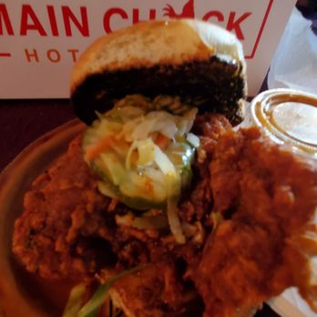Main Chick Hot Chicken - Dark meat sandwich with Mild spice & 1 of their MC sauces pictured in the back - Chicken Shop Near Me - Pasadena, California