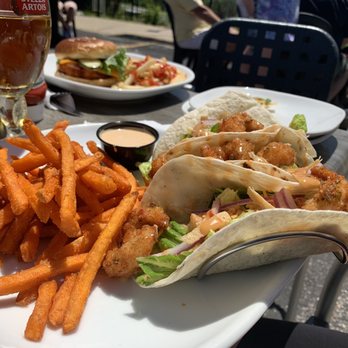 Boston Pizza - a plate of food and a glass of beer - Pizza Near Me - Orangeville, Ontario