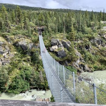 Yukon Suspension Bridge - Getting ready to walk across the bridge. - Landmarks & Historical Buildings Near Me - Whitehorse, Yukon
