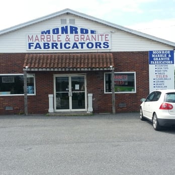 Monroe Marble & Granite Fabricators - a car parked in front of a building - Flooring Near Me - Brodheadsville, Pennsylvania Monroe Marble & Granite Fabricators - a car parked in front of a building - Flooring Near Me - Brodheadsville, Pennsylvania