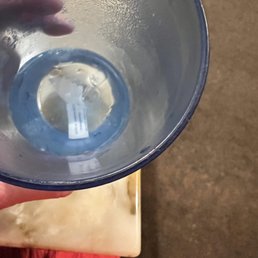 a person holding a glass of water