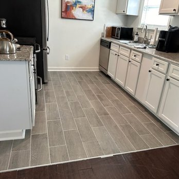 Accupro Constructions - Kitchen floor tile job - General Contractors Near Me