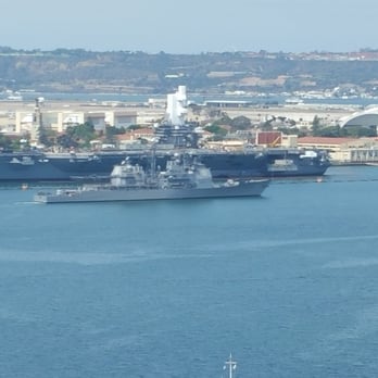 The Embarcadero - Guided Missile Cruiser CG 70, USS Lake Erie sailing out of port, appears puny compared to Aircraft Carrier CVN71, USS Theodore Roosevelt. - Local Flavor Near Me - San Diego, California The Embarcadero - Guided Missile Cruiser CG 70, USS Lake Erie sailing out of port, appears puny compared to Aircraft Carrier CVN71, USS Theodore Roosevelt. - Local Flavor Near Me - San Diego, California