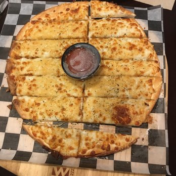 The Pizza Press - Celebration - Cheesy bread - Pizza Near Me - Kissimmee, Florida The Pizza Press - Celebration - Cheesy bread - Pizza Near Me - Kissimmee, Florida