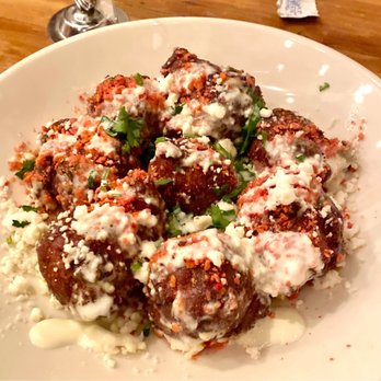 Crooked Ewe - Elote Hushpuppy ($10) - sweet corn, tajín, crema, cilantro, takis dust, queso fresco - Breweries Near Me - South Bend, Indiana