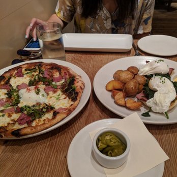Agricola Eatery - breakfast flat bread on the left eggs benedict on the right random jalapenos on the side - New American Near Me - Princeton, New Jersey