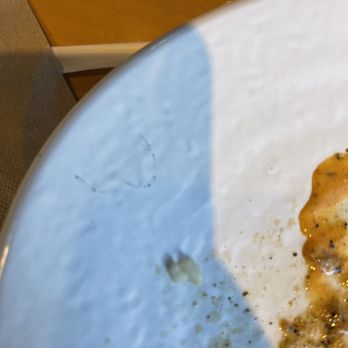 California Fish Grill - A piece of plastic fabric looks like from cleaning cloth in the calamari dish - Seafood Near Me - Upland, California California Fish Grill - A piece of plastic fabric looks like from cleaning cloth in the calamari dish - Seafood Near Me - Upland, California