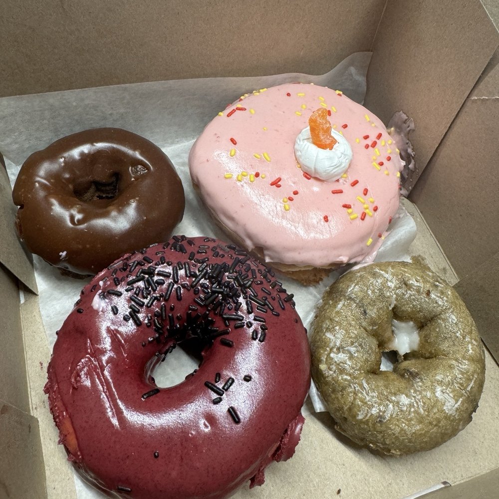 Voodoo Doughnut - Strawberry Lemonade Stand Viscous Hibiscus Double Chocolate Blueberry Cake - Donuts Near Me - Chicago, Illinois Voodoo Doughnut - Strawberry Lemonade Stand Viscous Hibiscus Double Chocolate Blueberry Cake - Donuts Near Me - Chicago, Illinois