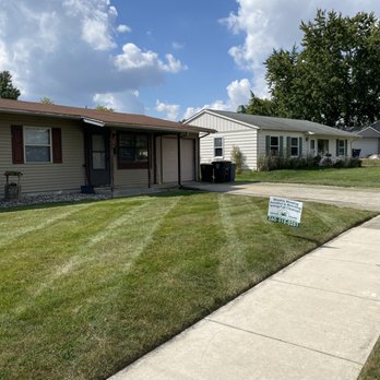 Precision Cuts Landmaintenace - a lawn with a lawn sign in front of a house - Lawn Services Near Me Precision Cuts Landmaintenace - a lawn with a lawn sign in front of a house - Lawn Services Near Me