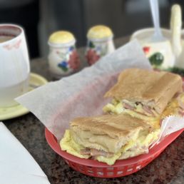 a sandwich and a cup of coffee a sandwich and a cup of coffee