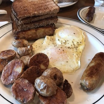 Mimi's Cafe - Eggs and sausage breakfast with toast. Dry potatoes as you can see. - American Near Me - Chesterfield, Missouri