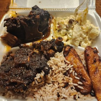 Bikkle Jamaican Restaurant - Oxtails with plantains and potato salad - Caribbean Near Me - Austin, Texas Bikkle Jamaican Restaurant - Oxtails with plantains and potato salad - Caribbean Near Me - Austin, Texas