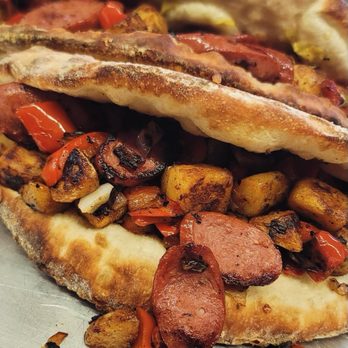 Raise Pizza - a hot dog and potatoes on a plate - Pizza Near Me - Magnolia, Texas Raise Pizza - a hot dog and potatoes on a plate - Pizza Near Me - Magnolia, Texas