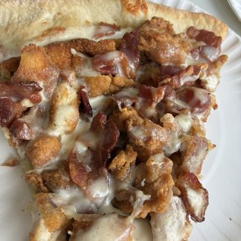 Pietro's Bistro - Slice of pizza with bacon chicken and a white sauce. - Pizza Near Me - Vineland, New Jersey Pietro's Bistro - Slice of pizza with bacon chicken and a white sauce. - Pizza Near Me - Vineland, New Jersey