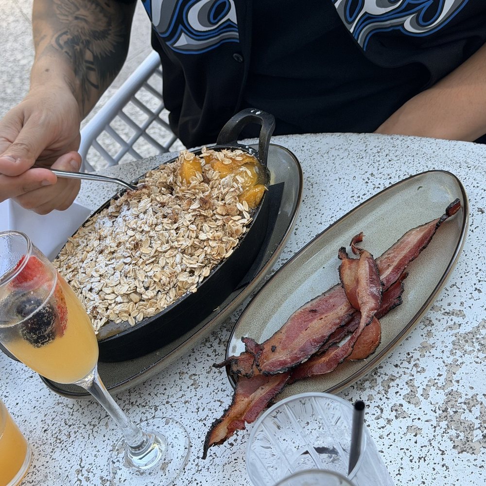 Parc - Peach Cobbler Baked Pancake + Side Bacon - New American Near Me - Detroit, Michigan Parc - Peach Cobbler Baked Pancake + Side Bacon - New American Near Me - Detroit, Michigan