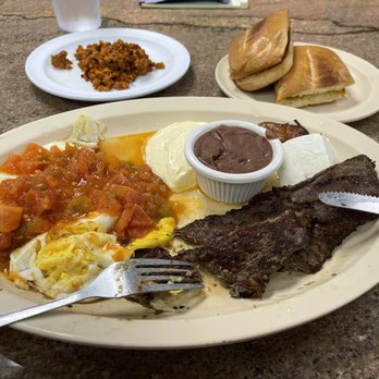 Latin Flavor - a plate of food on a table - Salvadoran Near Me - Plantation, Florida Latin Flavor - a plate of food on a table - Salvadoran Near Me - Plantation, Florida