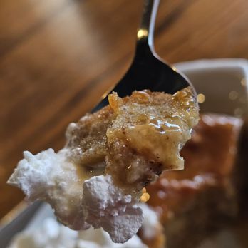 Martin's Downtown - A spoonful of the Glazed Doughnut Bread Pudding with vanilla ice cream and caramel sauce. Amazingly delicious. - Sports Bars Near Me - Roanoke, Virginia Martin's Downtown - A spoonful of the Glazed Doughnut Bread Pudding with vanilla ice cream and caramel sauce. Amazingly delicious. - Sports Bars Near Me - Roanoke, Virginia