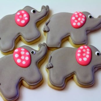 Thumbprints Baking - four decorated cookies with pink bows - Desserts Near Me