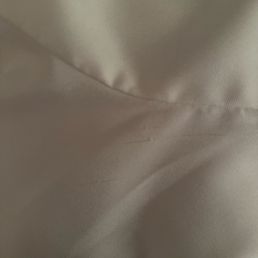 Damaged dress. Sewing machine mishap? Damaged dress. Sewing machine mishap?