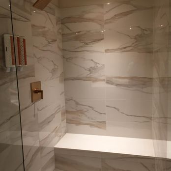 Circa - The Double King room bathroom has a large walk in shower with a bench. Also, there is a dispenser of shampoo/conditioner/body wash. - Casinos Near Me - Las Vegas, Nevada