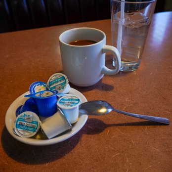Ely’s Restaurant - Coffee and water and assortment of creamers. - Breakfast & Brunch Near Me - Henderson, Nevada Ely’s Restaurant - Coffee and water and assortment of creamers. - Breakfast & Brunch Near Me - Henderson, Nevada