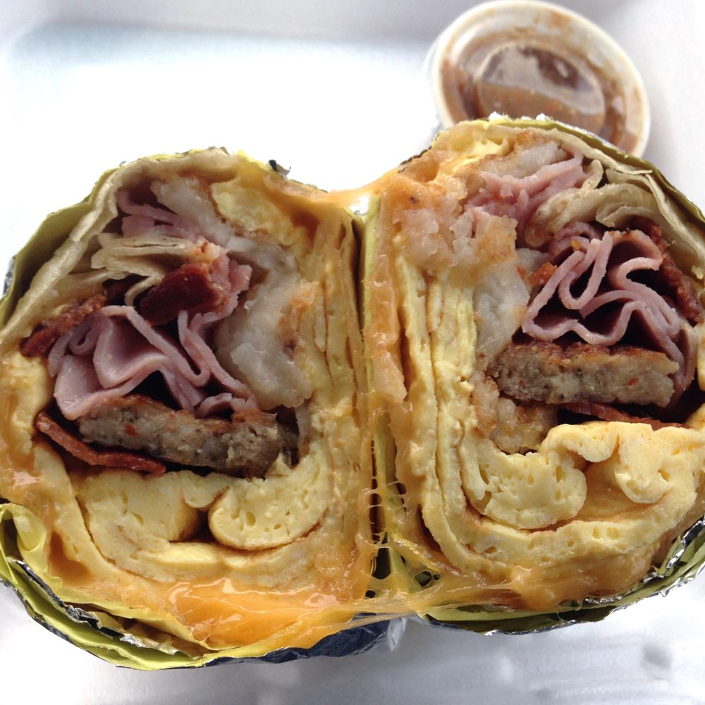 Master's Donuts - Cross section of Burrito #2 - ham, sausage, bacon, egg, cheese, and hash browns - Bakeries Near Me - Oxnard, California