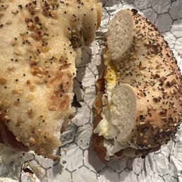 Bacon, egg and pepper Jack cheese on everything bagel with hot sauce and ketchup. Bacon, egg and pepper Jack cheese on everything bagel with hot sauce and ketchup.