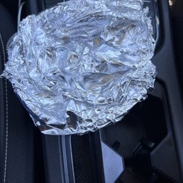 the inside of a car with tin foil on it