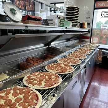 Jet's Pizza - A row of pizzas being prepared for a giant Scott's lawn order! - Pizza Near Me - Marysville, Ohio Jet's Pizza - A row of pizzas being prepared for a giant Scott's lawn order! - Pizza Near Me - Marysville, Ohio