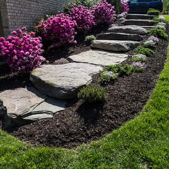 Custom Stonescaping - This yard dealt with drainage issues. Two new dry riverbeds, along with a walkway, stoop, pathway, boulders, stone steps, and plantings. - Landscaping Near Me - Falls Church, Virginia Custom Stonescaping - This yard dealt with drainage issues. Two new dry riverbeds, along with a walkway, stoop, pathway, boulders, stone steps, and plantings. - Landscaping Near Me - Falls Church, Virginia