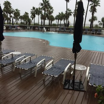 The Galvestonian - Rainy day by pool - Hotels Near Me - Galveston, Texas