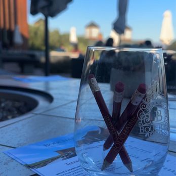 Bouchaine Vineyards - a glass of wine and a menu - Wine Tasting Room Near Me - Napa, California