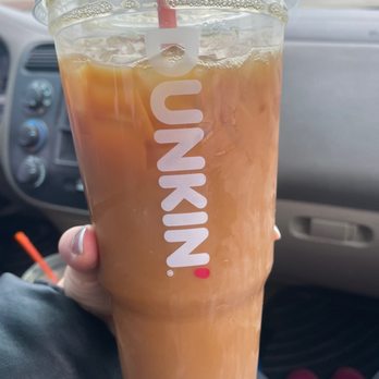 Dunkin' - a person holding a drink in their hand - Coffee & Tea Near Me - Machesney Park, Illinois Dunkin' - a person holding a drink in their hand - Coffee & Tea Near Me - Machesney Park, Illinois