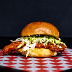 Pop Top Burgers - BUFFALO CHICKEN BURGER
Batter fried chicken breast smothered in a special blend buffalo sauce, bleu cheese, mayo spread, and lettuce.