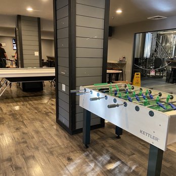 Central Coast Brewing - Back room seating area with Pool table, arcade games, foosball, and a few TVs. - Brewpubs Near Me - San Luis Obispo, California Central Coast Brewing - Back room seating area with Pool table, arcade games, foosball, and a few TVs. - Brewpubs Near Me - San Luis Obispo, California