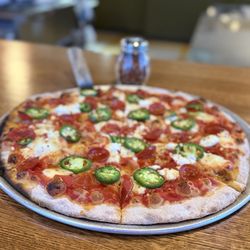 Lenny's Coal Fired Pizza - Lenny's Pie: tomato sauce, pepperoni, fresh jalapeño fresh mozzarella, honey, and goat cheese.