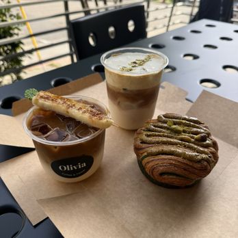 Olivia Coffee & Flower - Banana Milk Latte and Pistachio Cream Latte, with Pistachio Croissant - Florists Near Me - Oakland, California Olivia Coffee & Flower - Banana Milk Latte and Pistachio Cream Latte, with Pistachio Croissant - Florists Near Me - Oakland, California