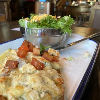 Brick Store Pub - Chicken salad melt and side chosen is a salad with lower level seating area in photo. - Pubs Near Me - Decatur, Georgia
