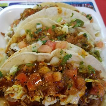 Carnitas La Yoca - Tacos de carnitas with cueritos after applying the most important thing... the salsa tatemada - Mexican Near Me - Tucson, Arizona