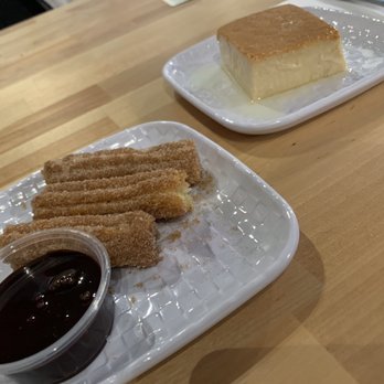 Stay & Play Game Cafe - A couple dessert options.- churros and flan - Cafes Near Me - Chicago, Illinois