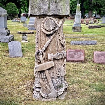 Forest Home Cemetery - A tree stump gravestone with many symbols. - Funeral Services & Cemeteries Near Me - Forest Park, Illinois Forest Home Cemetery - A tree stump gravestone with many symbols. - Funeral Services & Cemeteries Near Me - Forest Park, Illinois