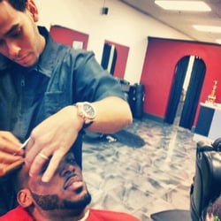 Dynasty Barber Shop - Dynasty barber shop.. Gio cutting Jemstar's hair