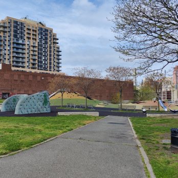Rainey Park - Glimpse of the play area (slides and climbing area).  Swings are off to the left (not pictured). - Parks Near Me - Astoria, New York